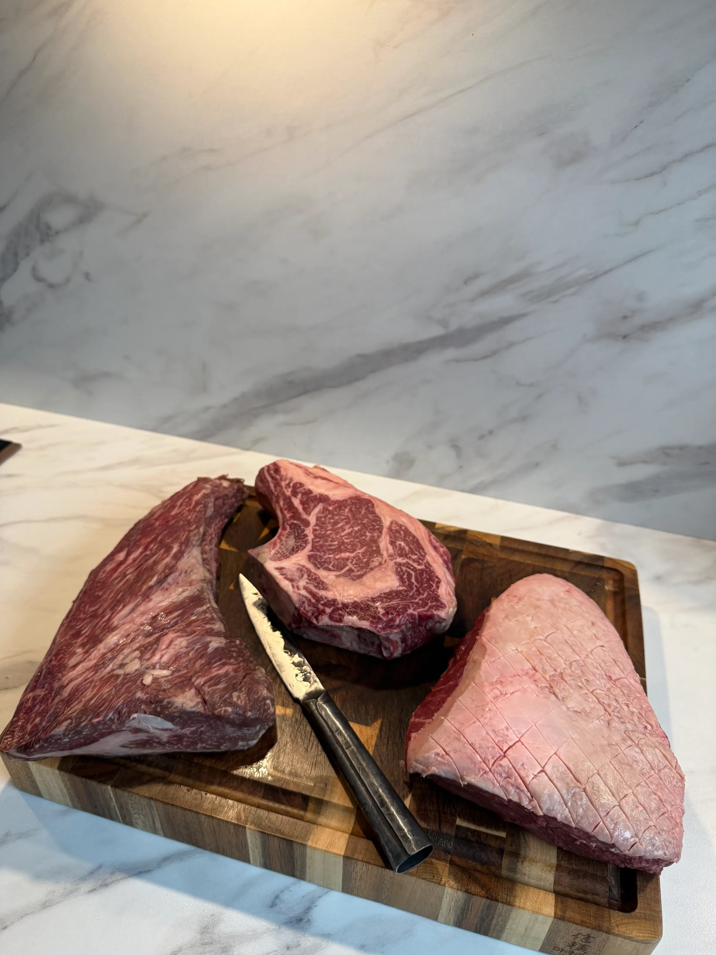 Drie premium cuts naast elkaar: wagyu, cote de boeuf en picanha